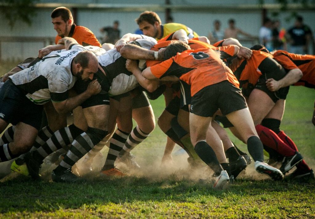 Rugby team in a scrum on the field